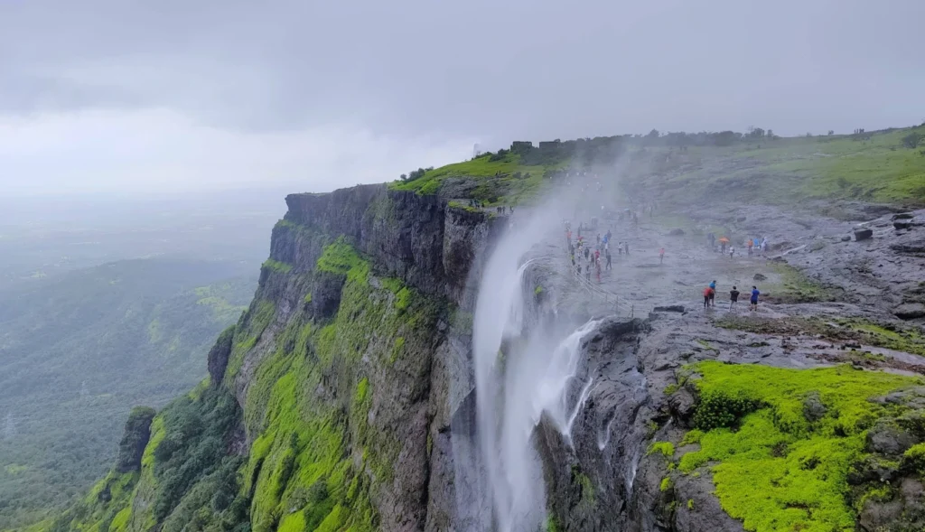 Reverse Waterfall at Naneghat near Lonavala during monsoon with scenic hills and misty valley views